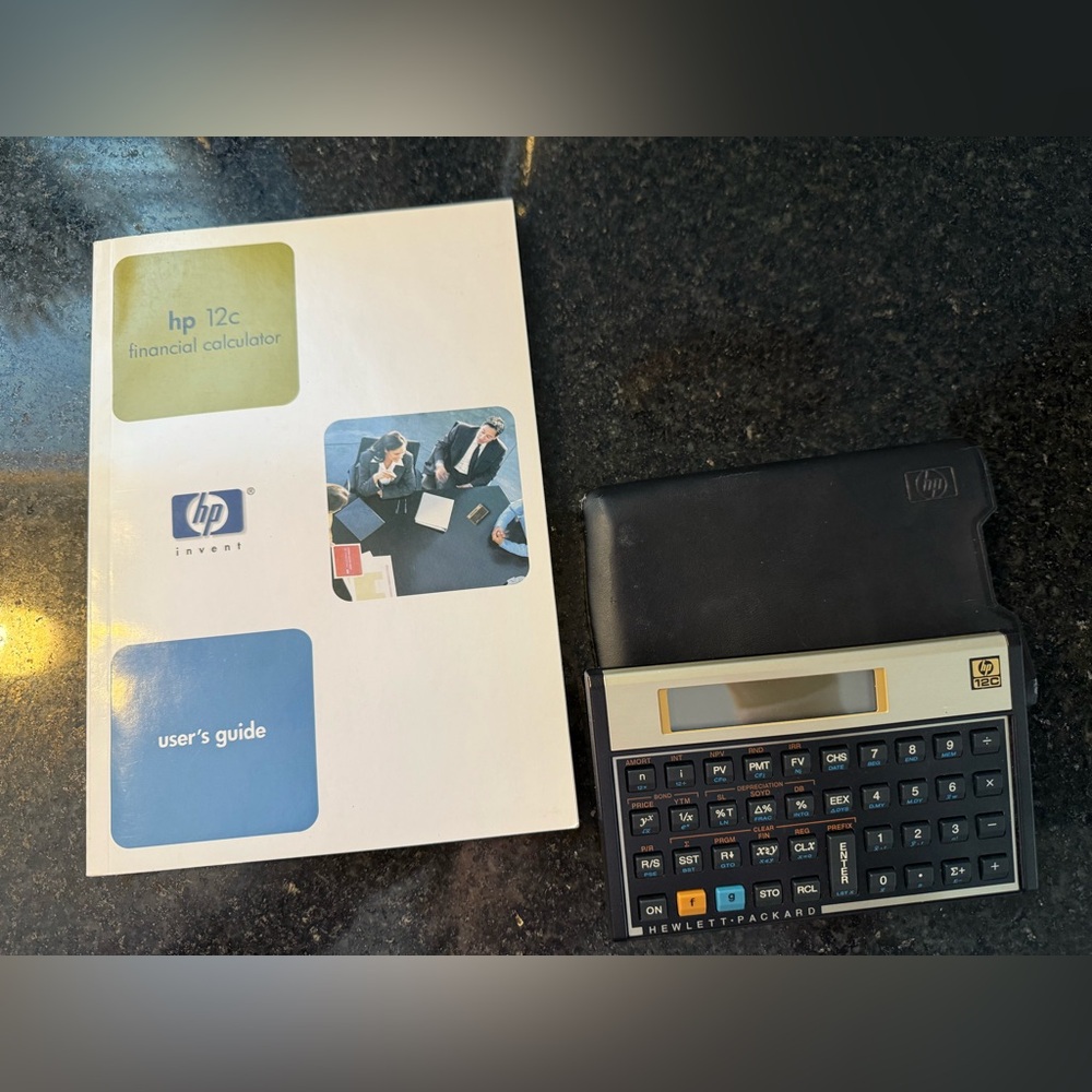 HP 12c Financial Calculator with manual and cover
